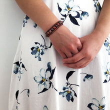 Red ripples bracelet shown with dress