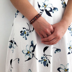 Red ripples bracelet shown with dress